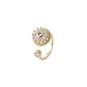 Sparkling gold sunflower ring with baguette-cut zircons and micro-pave crystals