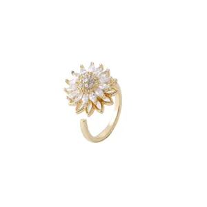 Rotating golden sunflower open ring with shimmering cubic zirconia flower petals