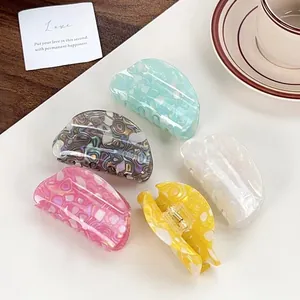 Five-piece set of stylish speckled PVC hair claw clips in varied pearlescent colors