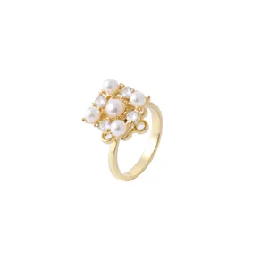 Elegant gold vintage ring featuring five white pearls and sparkling zircon accents