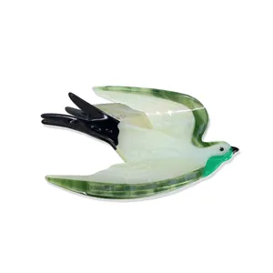 Elegant acetate swallow bird hair claw clip in pearl green, white and black finish
