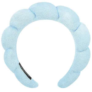 Padded light blue sponge headband with soft knit texture and handmade inner label