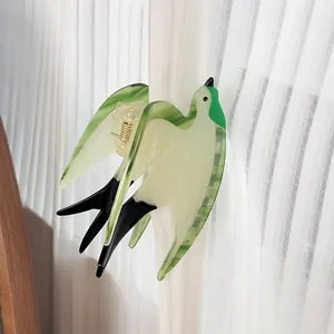 Acetate swallow bird hair claw clip in emerald green and white for elegant styling