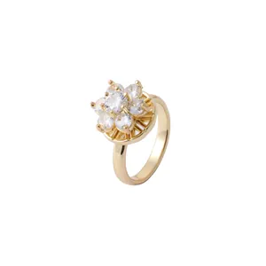 Elegant gold flower ring featuring a sparkling central zircon surrounded by white diamonds
