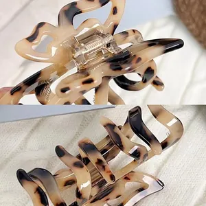 Elegante molletta per capelli in acetato tartarugato con design a fiocco a farfalla