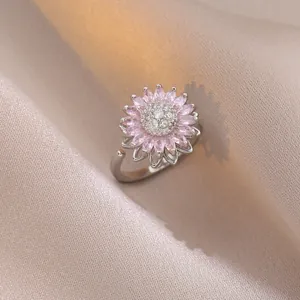 Bague tournante tournesol avec zircons roses et anneau réglable en métal argenté