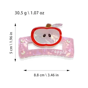 Pink apple hair claw clip in pearlescent acetate with size and weight measurements