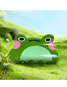 Pince à cheveux grenouille mignonne en acrylique vert sur fond d'herbe naturelle