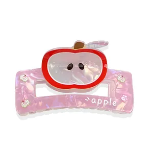Pink marble hair claw clip with cute cartoon apple design and white apple text