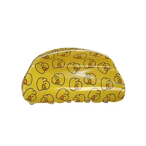 Pince à cheveux demi-lune jaune avec motifs canards mignons et finition brillante