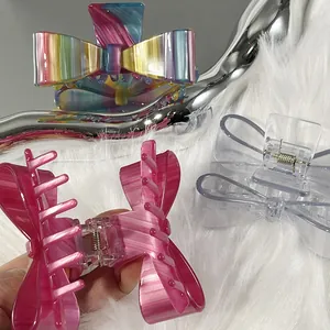 Elegant bow-shaped acetate hair claw clips in colorful marble and transparent styles