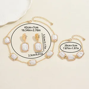 Retro gold jewelry set with geometric pearls including necklace, bracelet and earrings