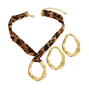 Fashion jewelry set with leopard print silk necklace and irregular gold metal pendants