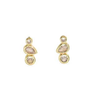 Elegant gold-plated geometric stud earrings with clear round and pear-shaped crystals