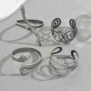 Set de 4 brazaletes de serpiente vintage plateados con ojos de cristal rojo y escamas