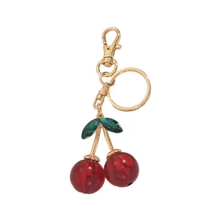 Cute cherry keychain with red beads, green crystal leaves and gold lobster clasp