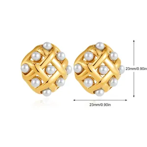 Detail view of gold woven texture earrings with pearls measuring 23mm in diameter