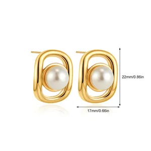 Macro view of gold oval stud earrings with pearl showing dimensions 22mm by 17mm