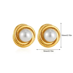 Detail of 18mm golden spiral earrings with pearl inlay and diameter dimension marker
