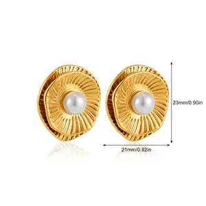 Detail view of shell-shaped gold earrings with white pearl and 23mm size label