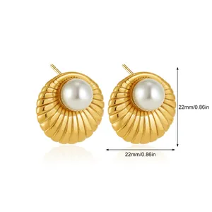 Macro shot of 22mm gold scallop-textured earrings with white pearl center and 0.86in size marking