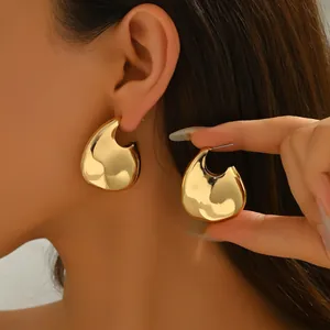 Polished 18k gold plated geometric teardrop earrings for women with a modern fluid design