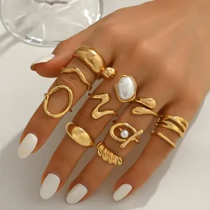10-piece gold geometric ring set for women featuring elegant pearls and wavy designs
