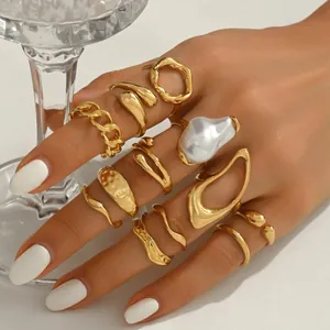 11-piece set of gold geometric rings with irregular pearls and twisted bands