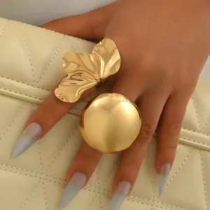 Golden geometric ring set featuring large chunky leaf and dome designs for women