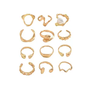 12-piece gold geometric ring set featuring minimalist bands and irregular pearl accent
