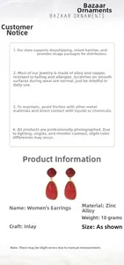 Detail view of red teardrop gemstone earrings set in high-quality zinc alloy metal