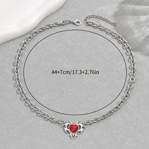 Hip-hop heart necklace with red gemstone and rhinestones on a chunky silver chain