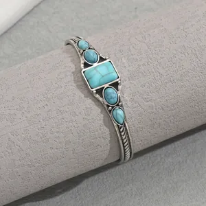 Vintage silver open bangle with geometric turquoise inlay and woven texture detailing