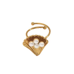 Golden shell ring with four white pearls and minimalist adjustable open band design