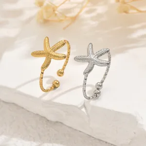 Gold and silver starfish toe rings with hammered texture for a beach vacation style