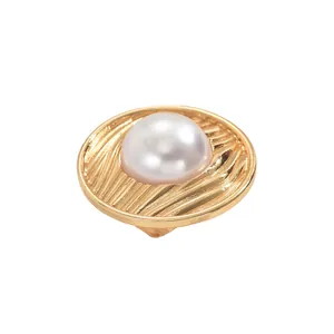 Elegant gold wavy textured ring with large central white pearl on a clean white background