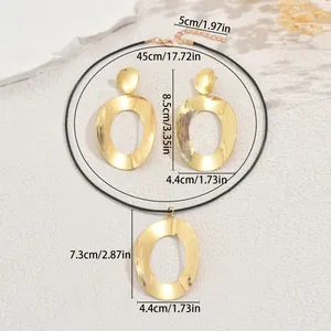 Minimalist gold geometric jewelry set featuring large oval necklace and earrings for women