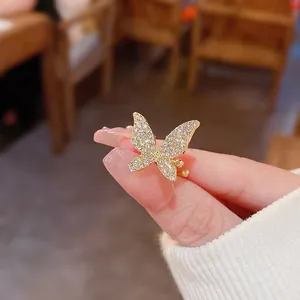 Elegant gold butterfly ear cuff featuring sparkling pavé crystals for women
