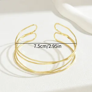 Bracciale rigido dorato a più strati ondulato con misura diametro interno di 7,5 cm