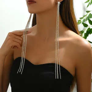 Elegant bow design earrings with long silver rhinestone tassels and a pear-shaped diamond