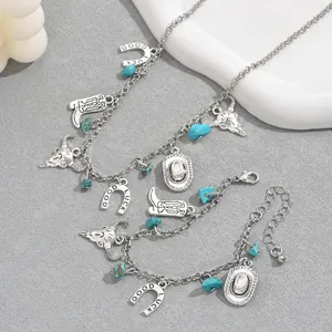 Detail of western style jewelry set with bull skull and lucky horseshoe charms