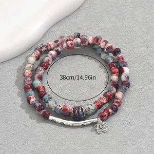Multilayer beaded flower bracelet with vintage floral design and bohemian style charms