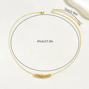 Golden geometric pendant necklace with sparkling rhinestones and adjustable extension chain