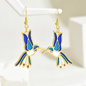 Elegant gold hummingbird drop earrings with colorful blue and white enamel inlay