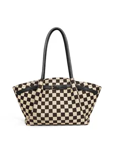 Macro shot of thick canvas checkerboard pattern with black leather strap details