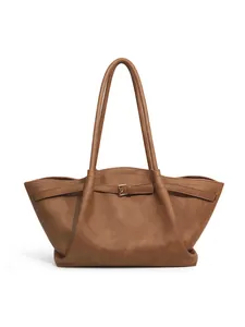 Detailed view of dark brown checkerboard tote bag with premium leather texture and strap