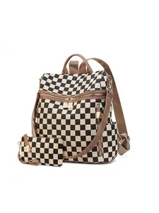 Detail view of checkerboard backpack set with matching pouch and brown leather trim
