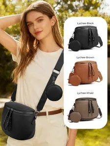 Detail of lychee textured crossbody bag with mini pouch in black, brown and khaki colors
