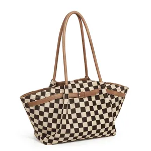 Large checkered tote bag with brown leather handles and side buckles for daily commute