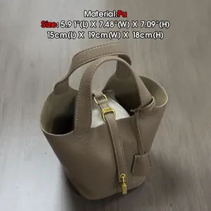 Taupe PU leather bucket bag with litchi texture, golden hardware and inner pouch